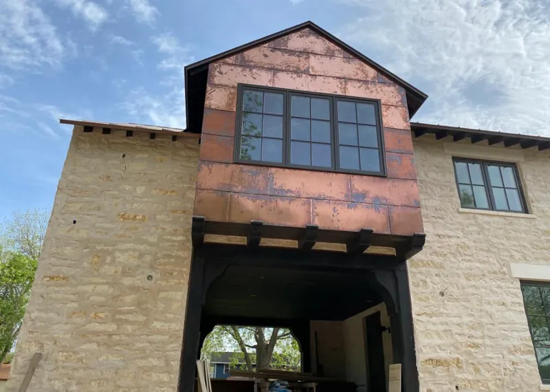 Copper metal panel facade on a stone building for Skylight Installation in Rutherford